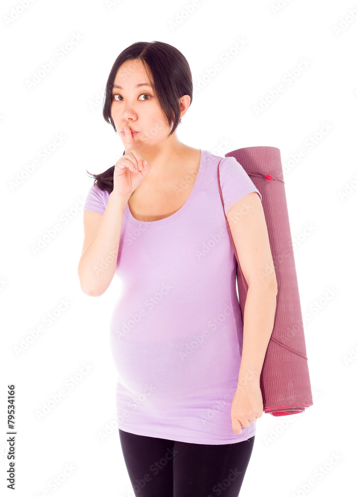 Pregnant asian woman isolated on white with a secret Pregnant asian woman isolated on white with a secret