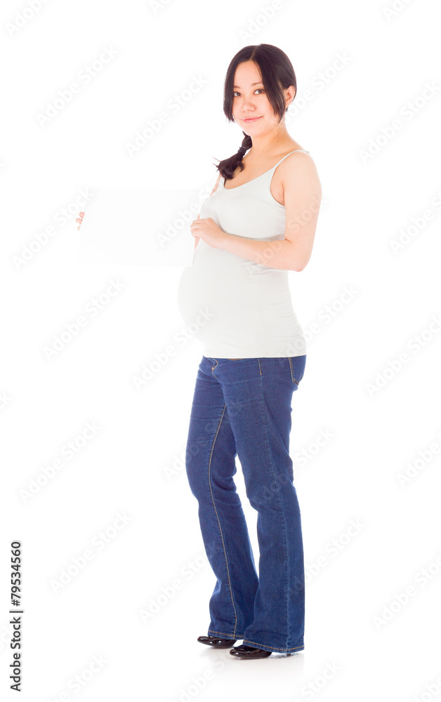 Pregnant asian woman isolated on white with sign Pregnant asian woman isolated on white with sign