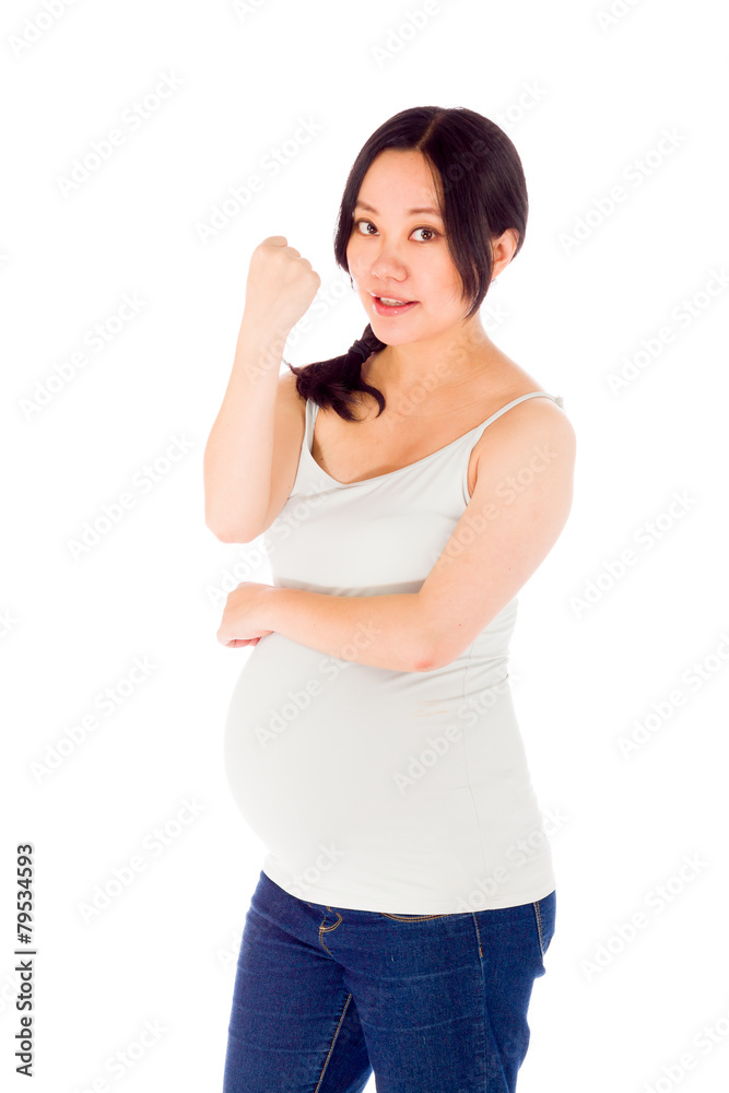 Pregnant asian woman isolated on white showing fist for strength Pregnant asian woman isolated on white showing fist for strength