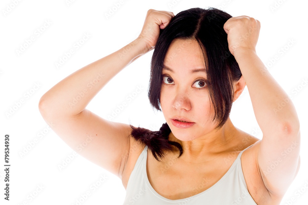 Pregnant asian woman isolated on white pulling her hairs Pregnant asian woman isolated on white pulling her hairs