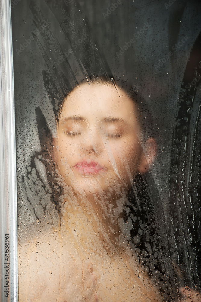 Woman standing at the shower.