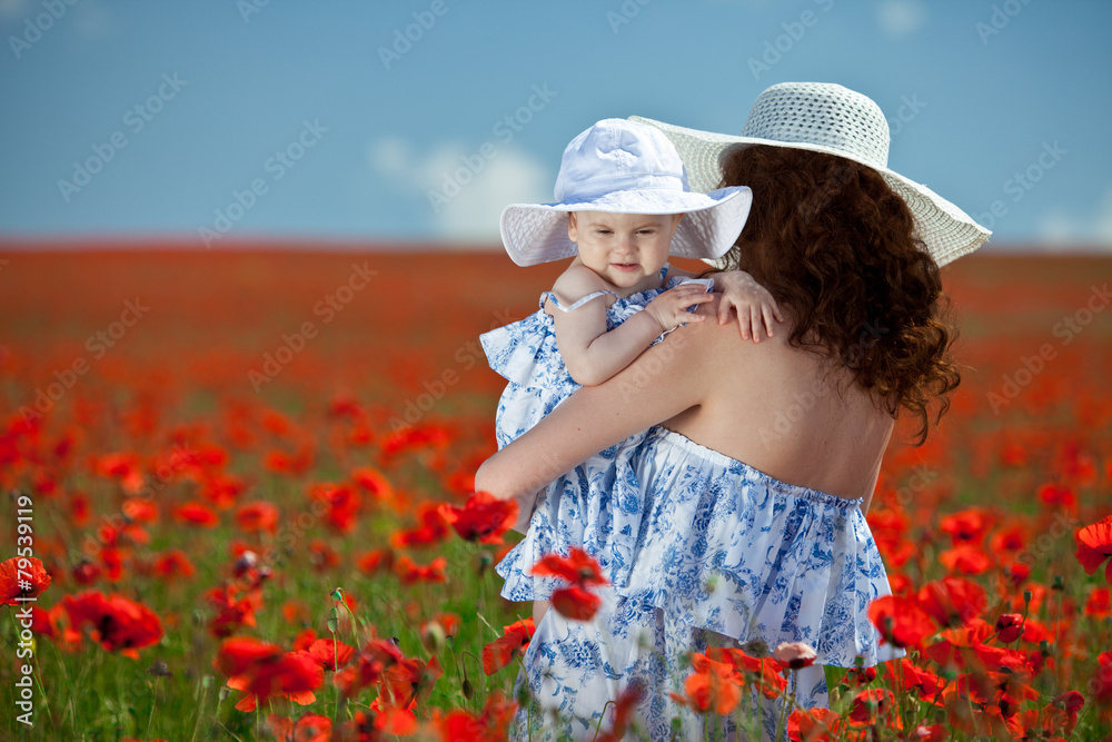 baby with his mother enjoying a field day outdoors 