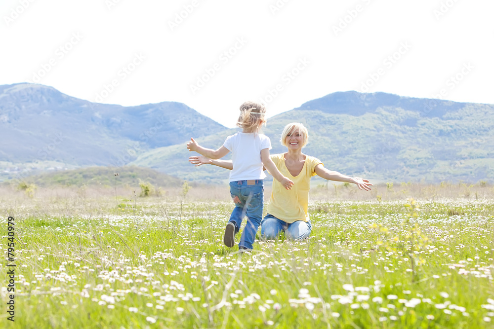 Happy woman with a child resting on the nature Happy woman with a child resting on the nature