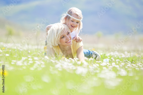 Happy woman with a child resting on the nature