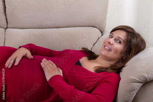 Close up view of a expecting pregnant happy woman