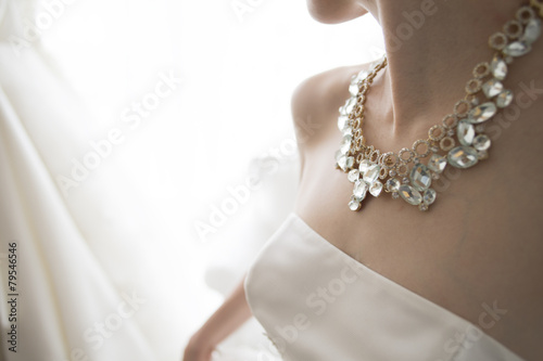 The bride wears a gorgeous necklace