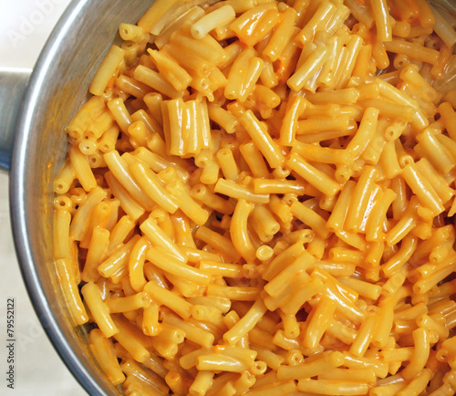 Pot of cooked and mixed Macaroni and Cheese prepared from a box