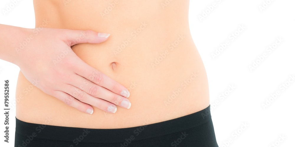 Closeup mid section of a fit woman with stomach pain