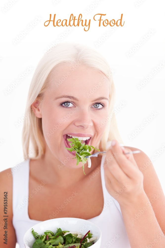 Healthy food against gorgeous woman eating salad Healthy food against gorgeous woman eating salad
