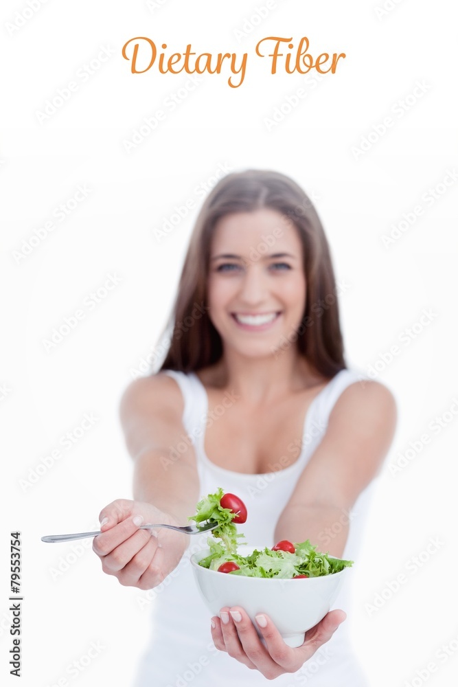 Delicious salad being eaten by a young woman Delicious salad being eaten by a young woman