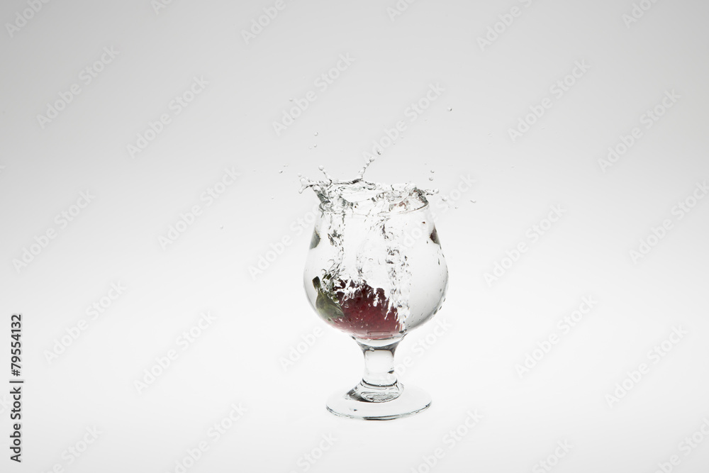 Close-up image of strawberry dropped to water Close-up image of strawberry dropped to water