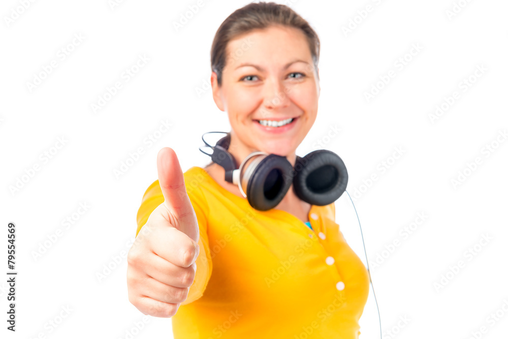 girl with headphones shows satisfaction girl with headphones shows satisfaction