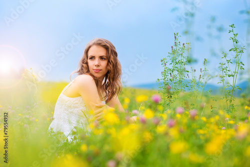 Beautiful woman on a meadow.