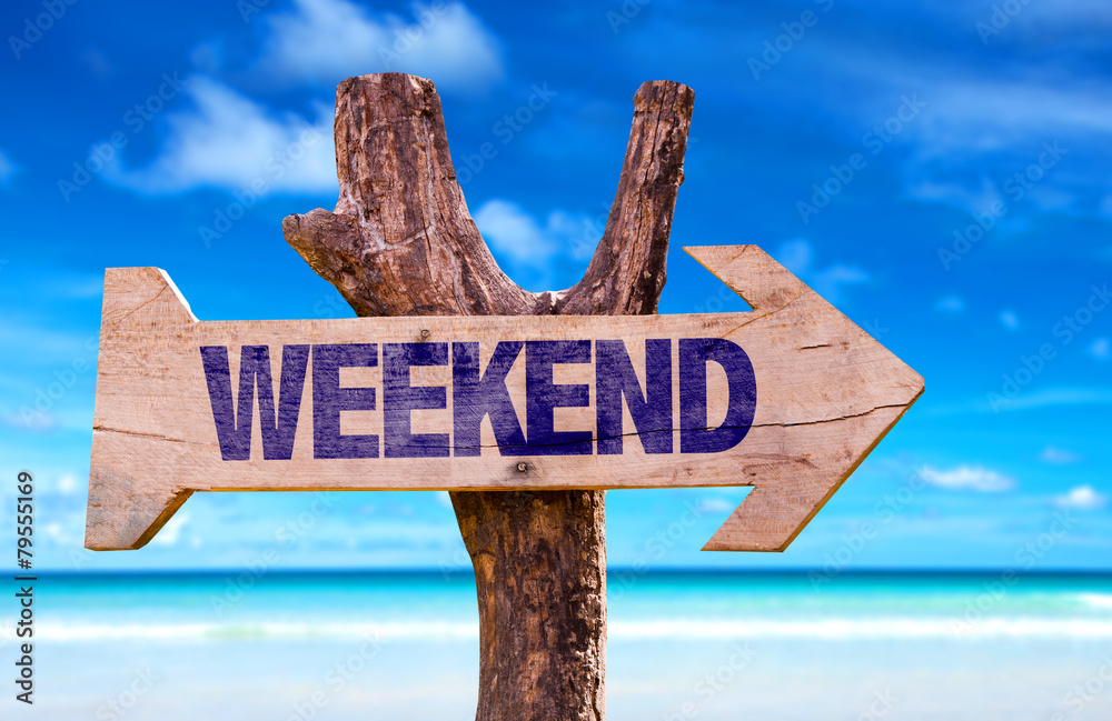 Weekend wooden sign with beach background