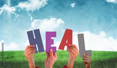 Foto Composite image of hands holding up heal