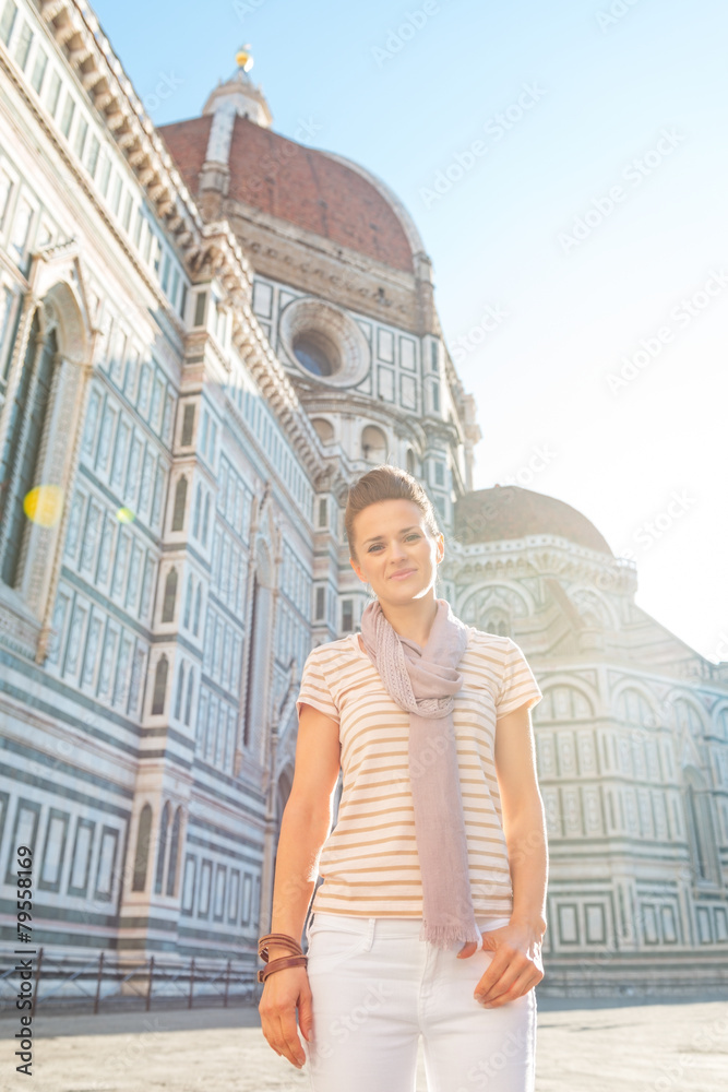 Portrait of happy young woman in front of cattedrale in firenze