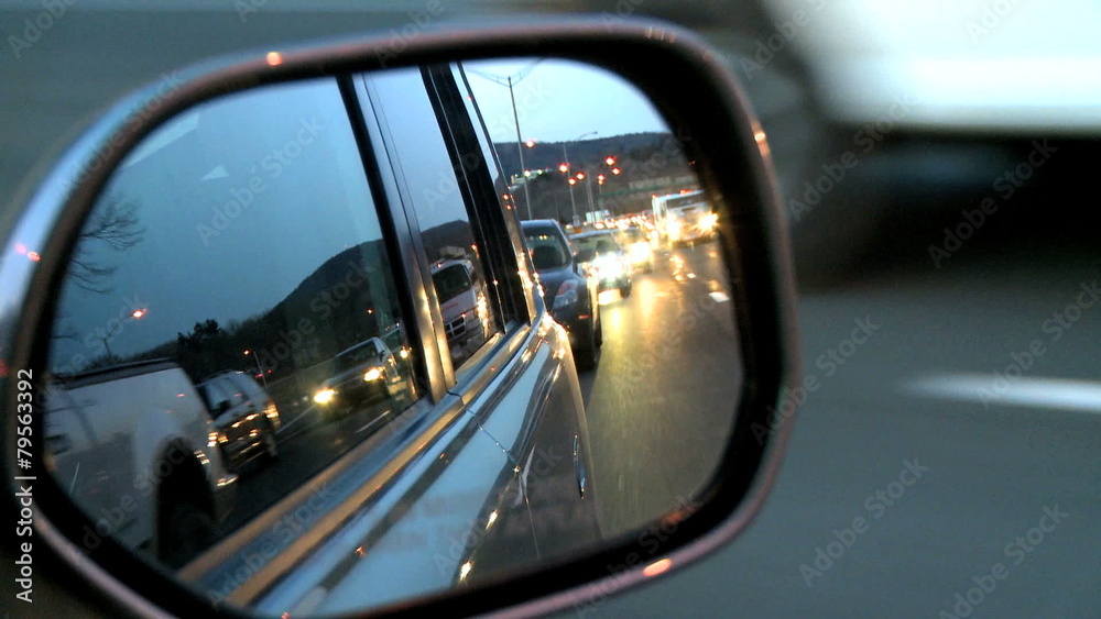 Light rush hour traffci of cars and trucks travel along a major U.S. roadway. Light rush hour traffci of cars and trucks travel along a major U.S. roadway.