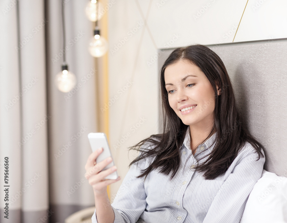 happy businesswoman with smartphone in hotel room happy businesswoman with smartphone in hotel room