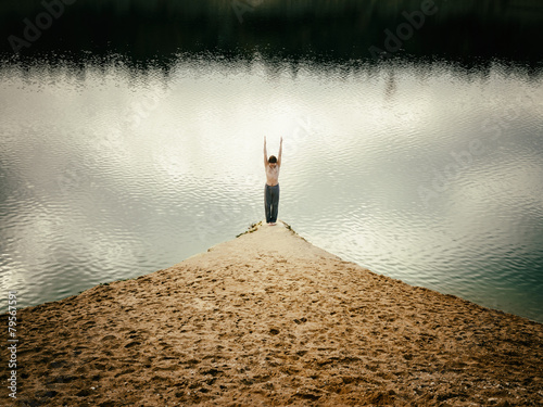 man practices yoga and leads healthy lifestyle