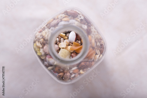 glass bottle with seeds, various cereals inside
