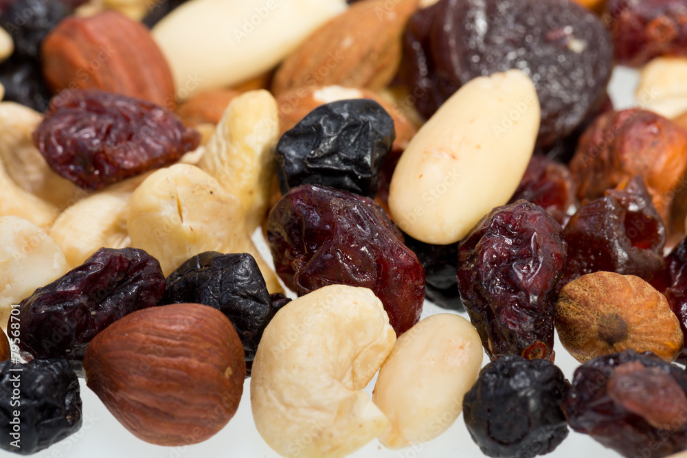 mixed nuts and dried fruits isolated on white background mixed nuts and dried fruits isolated on white background
