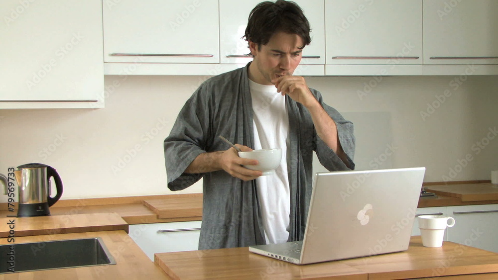 MS OF A MAN HAVING BREAKFAST USING A LAPTOP MS OF A MAN HAVING BREAKFAST USING A LAPTOP
