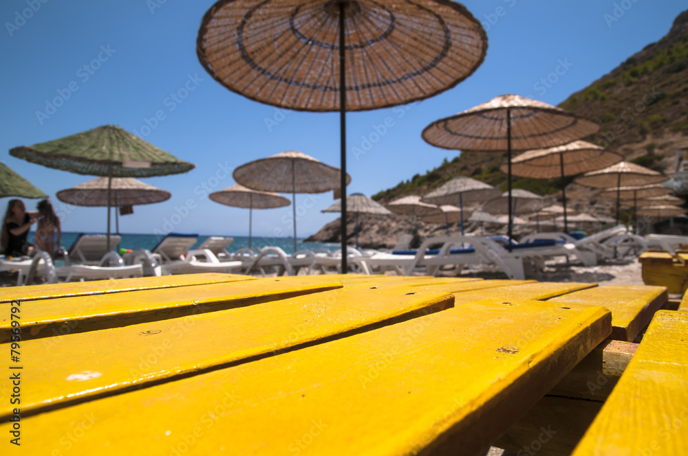 Straw umbrella on a beach.