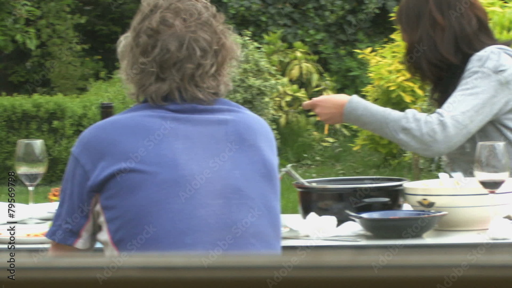 MS PAN OF A FAMILY HAVING A MEAL MS PAN OF A FAMILY HAVING A MEAL