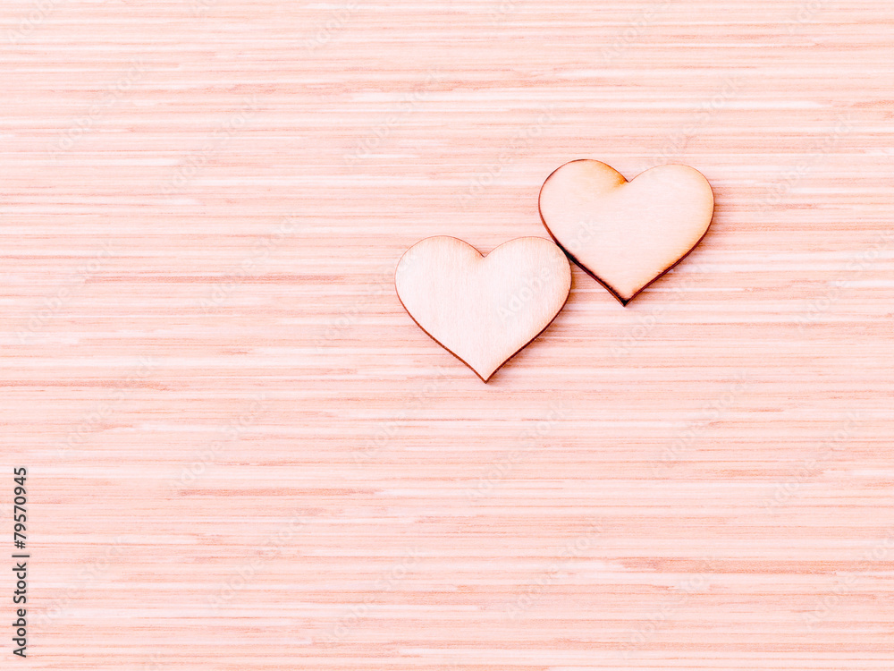 The wooden hearts on wooden background. - Concept for love and w The wooden hearts on wooden background. - Concept for love and w