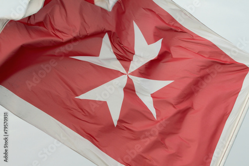 Schilderij op canvas Fluttering Maltese flag
