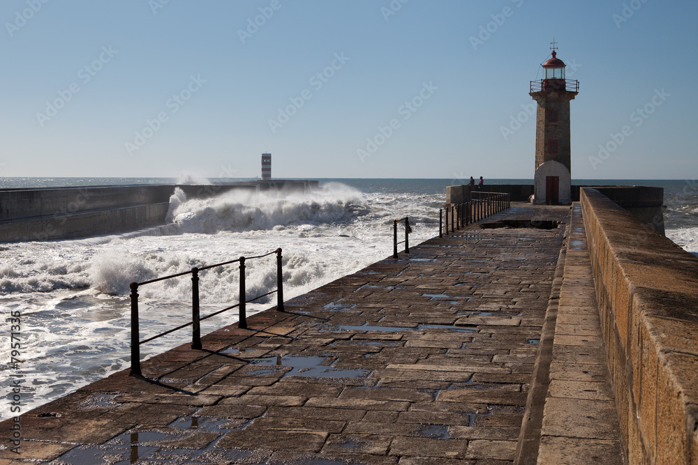 Waves on brekwater in Porto, Portugal.