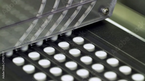 Pills at an automatic packaging line at a pharmaceutical factory