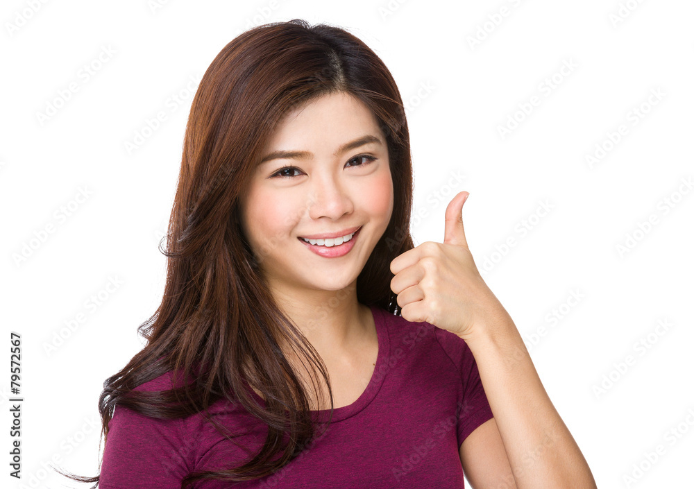 Portrait of a beautiful young asian woman showing thumbs up Portrait of a beautiful young asian woman showing thumbs up