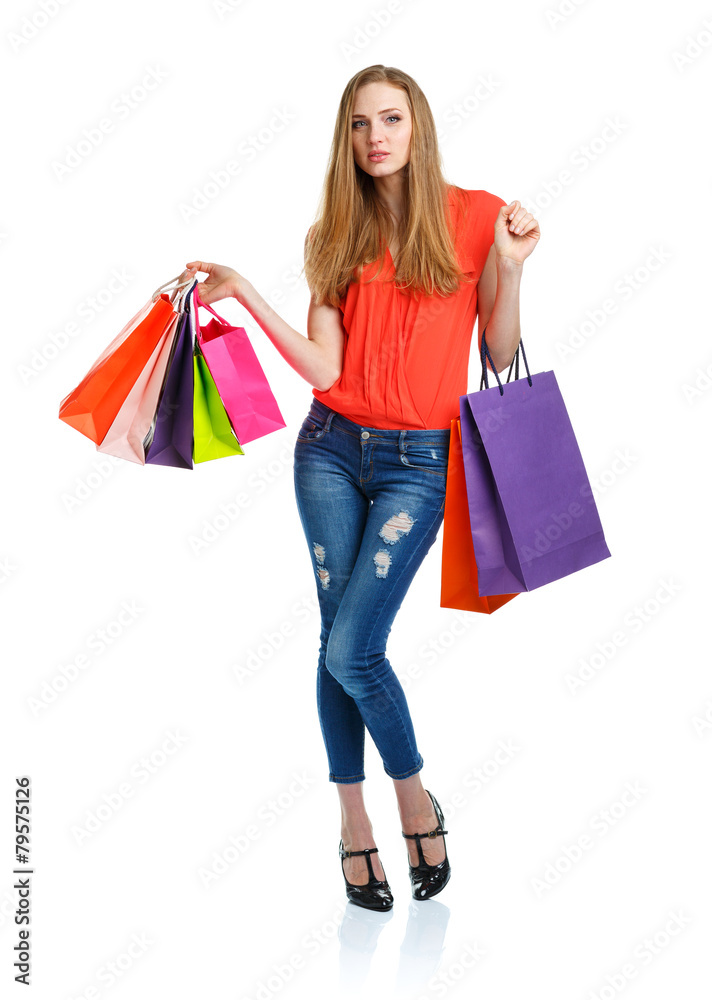 Happy caucasian woman holding shopping bags on white. Holidays c Happy caucasian woman holding shopping bags on white. Holidays c