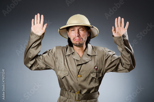 Funny safari hunter against background