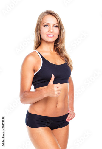 Young athletic girl with a finger up on white