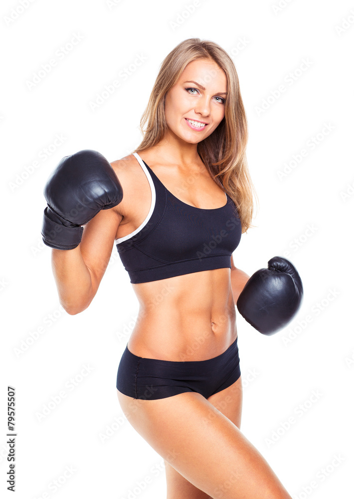 Young athletic woman in boxing gloves on a white Young athletic woman in boxing gloves on a white