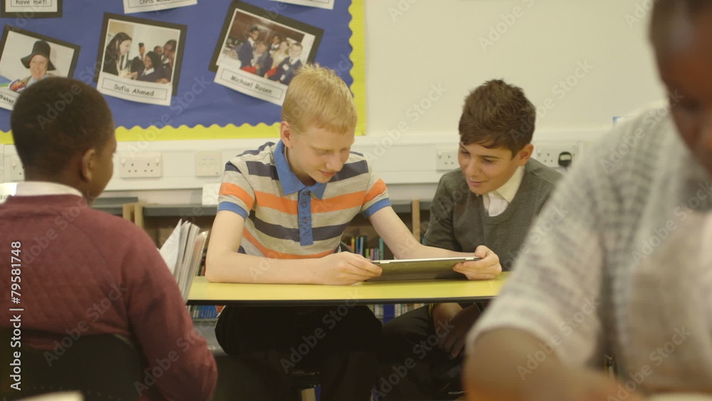 Schoolboys using tablet Schoolboys using tablet