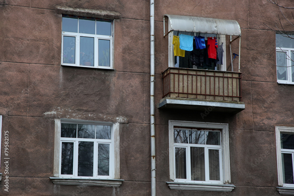Four window of dark house with balcony