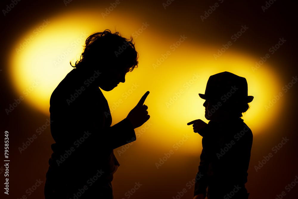 Two  expressive boy's silhouettes showing emotions using gesticu