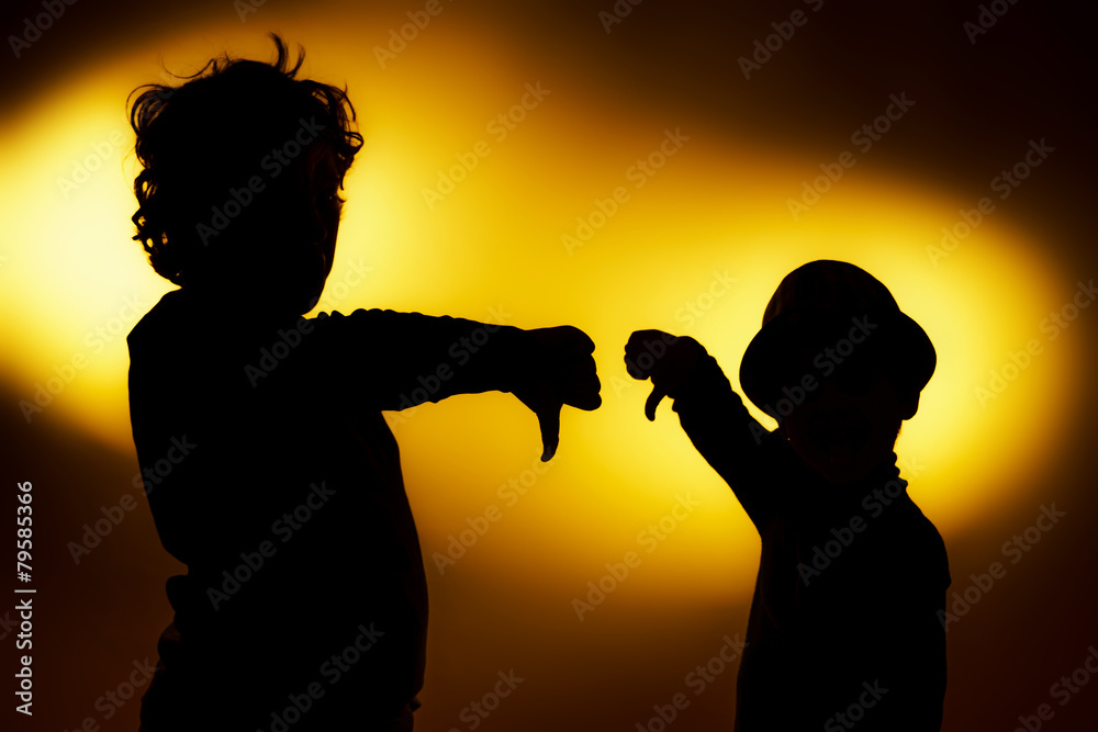 Two  expressive boy's silhouettes showing emotions using gesticu