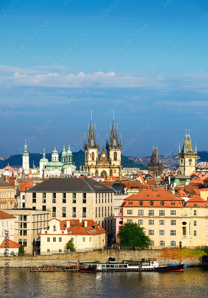 Roofs of Old Prague with famous towers on a bright summer day. T
