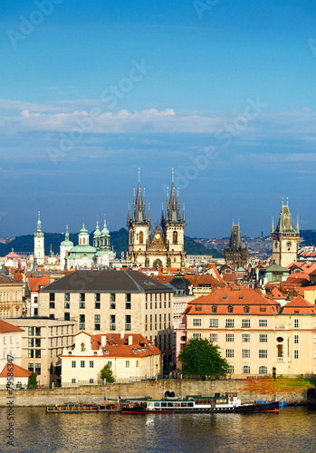 Roofs of Old Prague with famous towers on a bright summer day. T