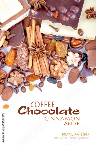 Various pieces of chocolate with nuts, raisins and coffee beans