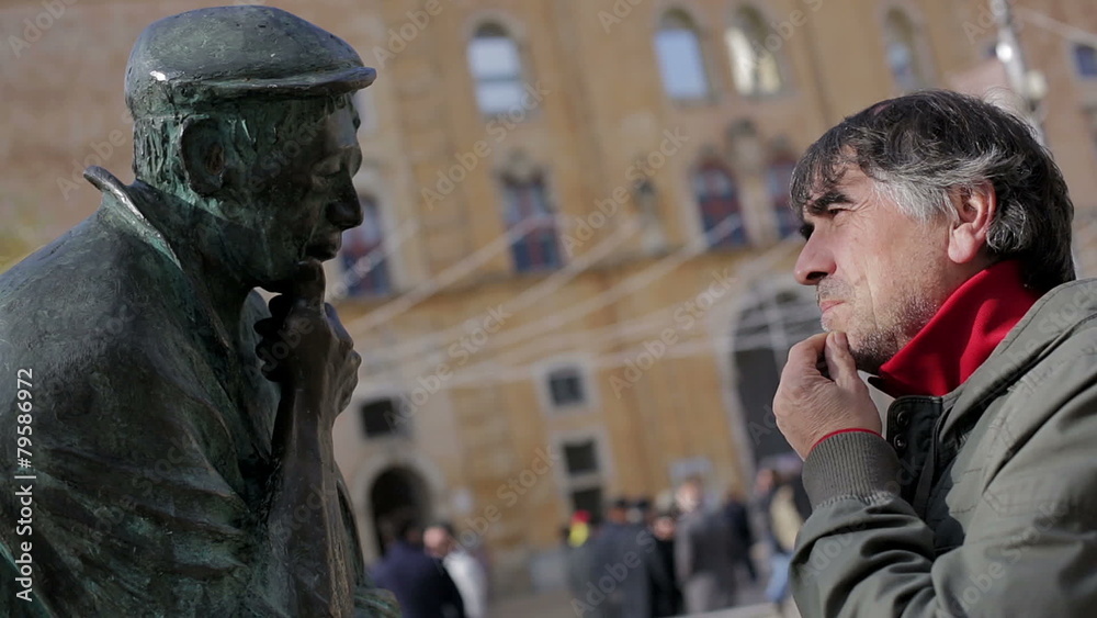 Pensive man and pensive statue Pensive man and pensive statue