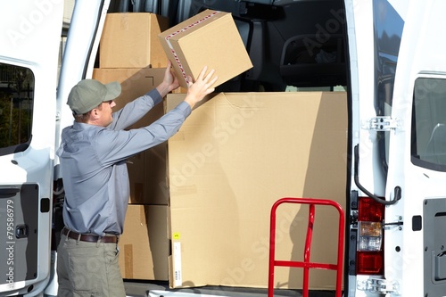 Postman with parcel box. photo