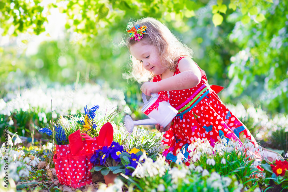 Little girl working in the garden Little girl working in the garden