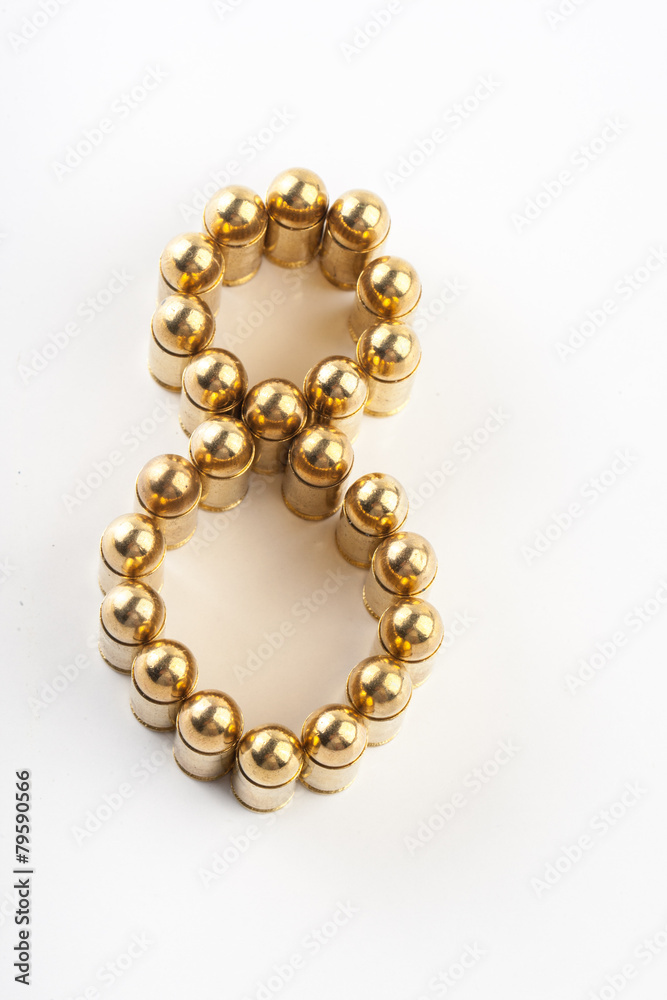 Numbers made of 9 mm cartridges on white background Numbers made of 9 mm cartridges on white background