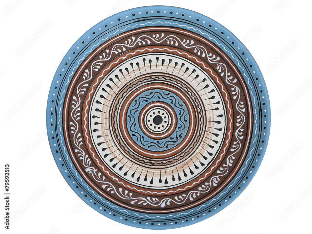 Obraz premium handmade ornated pottery plate isolated on white