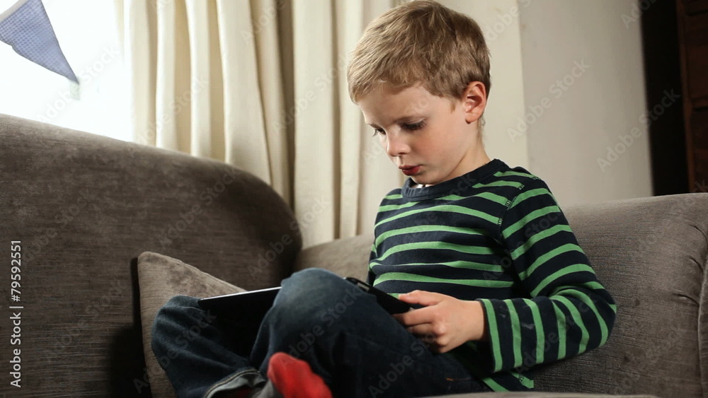Boy looking to digital tablet Boy looking to digital tablet